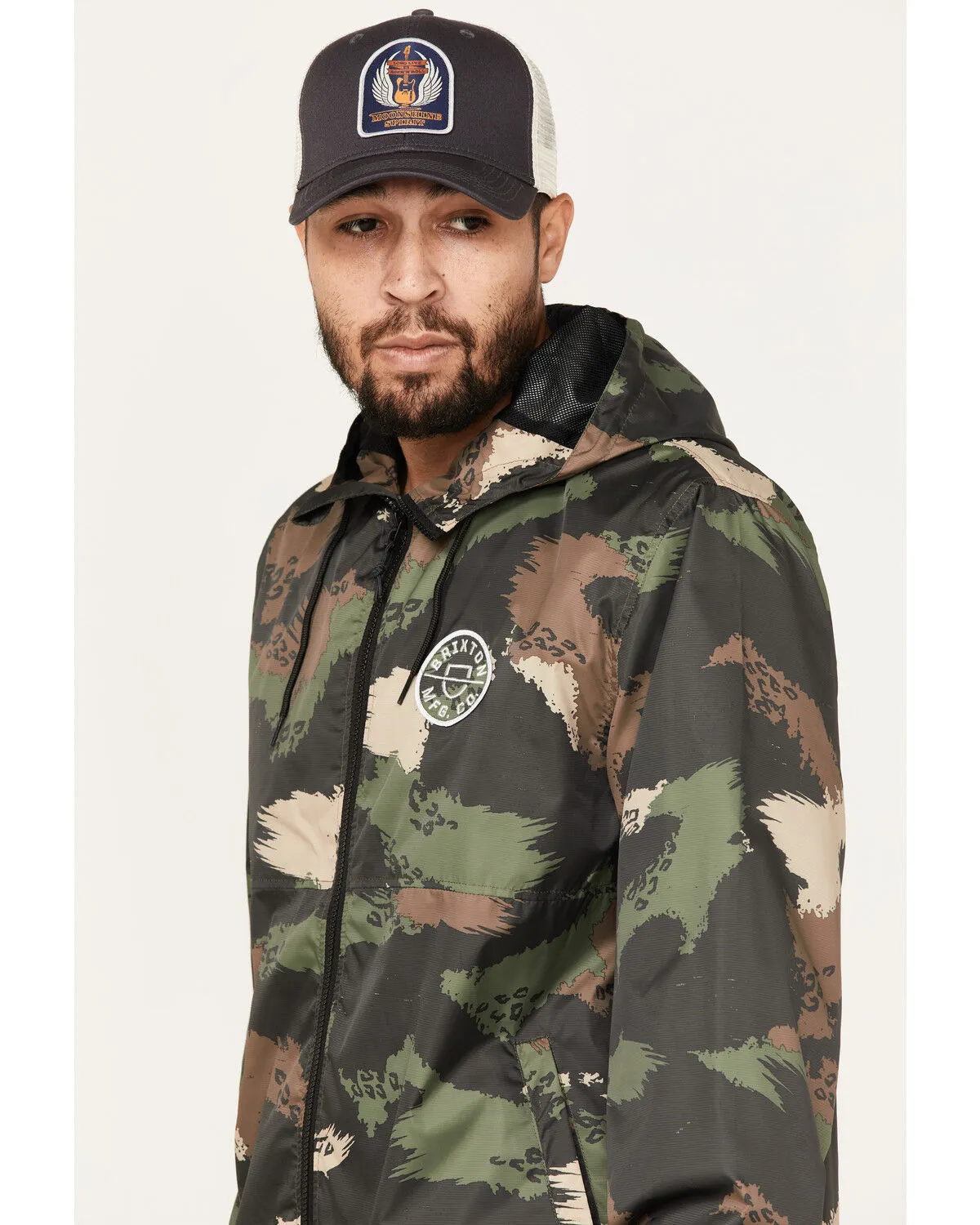 Product Name:  Brixton Men's Camo Print Claxton Crest Logo Graphic Hooded Zip Jacket